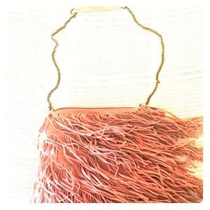 Pink suede fringe purse.